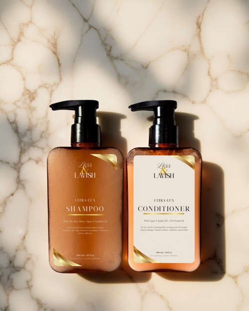 Two bottles of  Less & Lavish Shampoo and Conditioner Duo on a marble surface