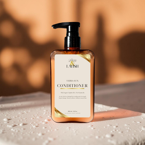 Less & Lavish Ultra-Lux Conditioner bottle with pump on a textured surface and blurred background