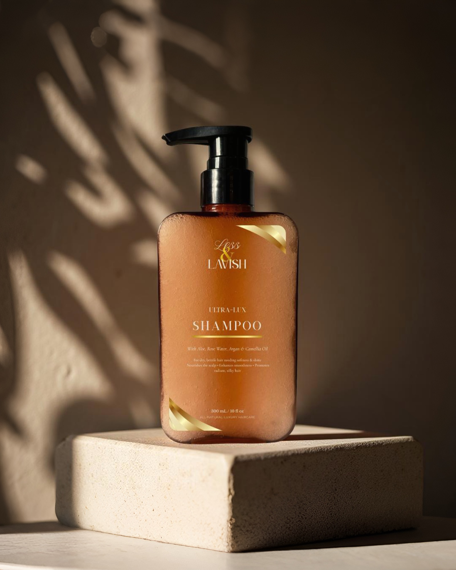 Less & Lavish Ultra Lux Shampoo bottle on a neutral stone background