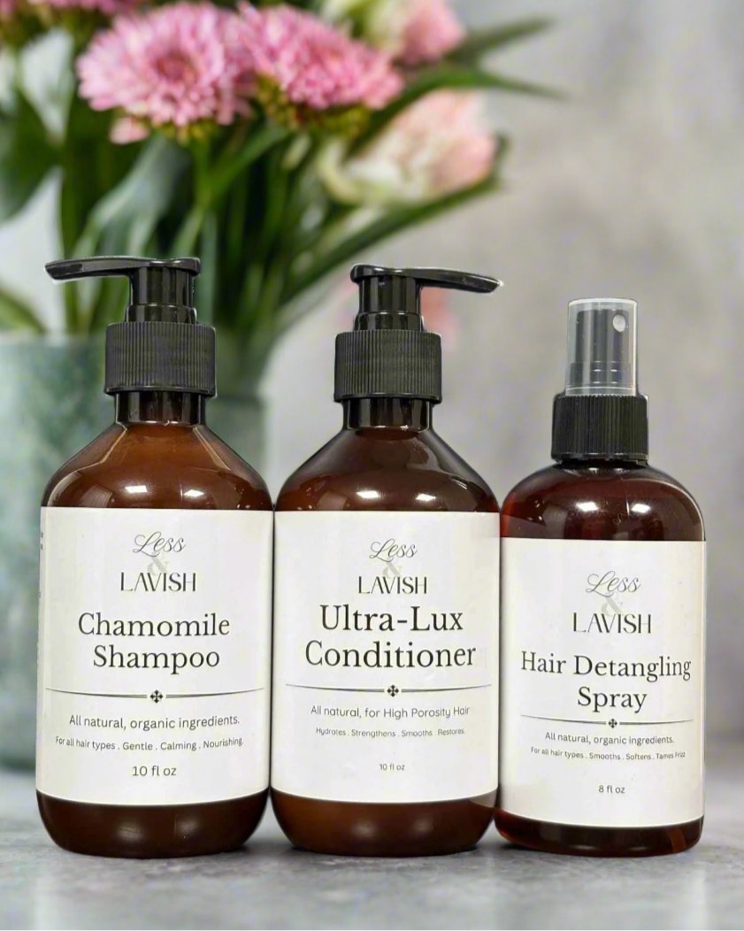 Less & Lavish chamomile shampoo, ultra-lux conditioner, and detangling spray in amber glass bottles — natural hair care products for sensitive scalps and high porosity hair